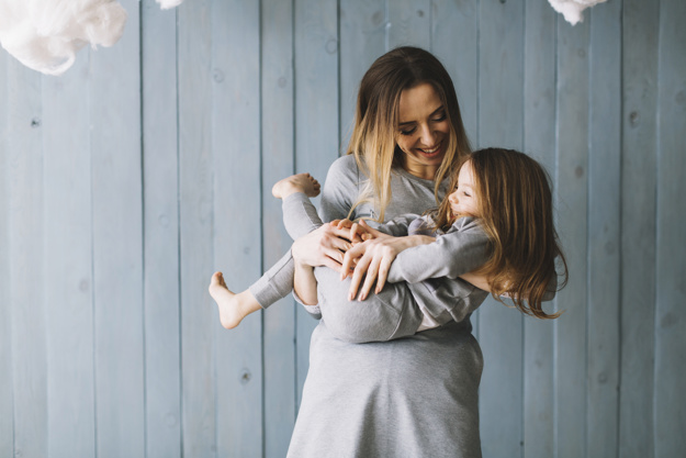 smiling-mother-and-daughter-celebrating-mothers-day_23-2147776587